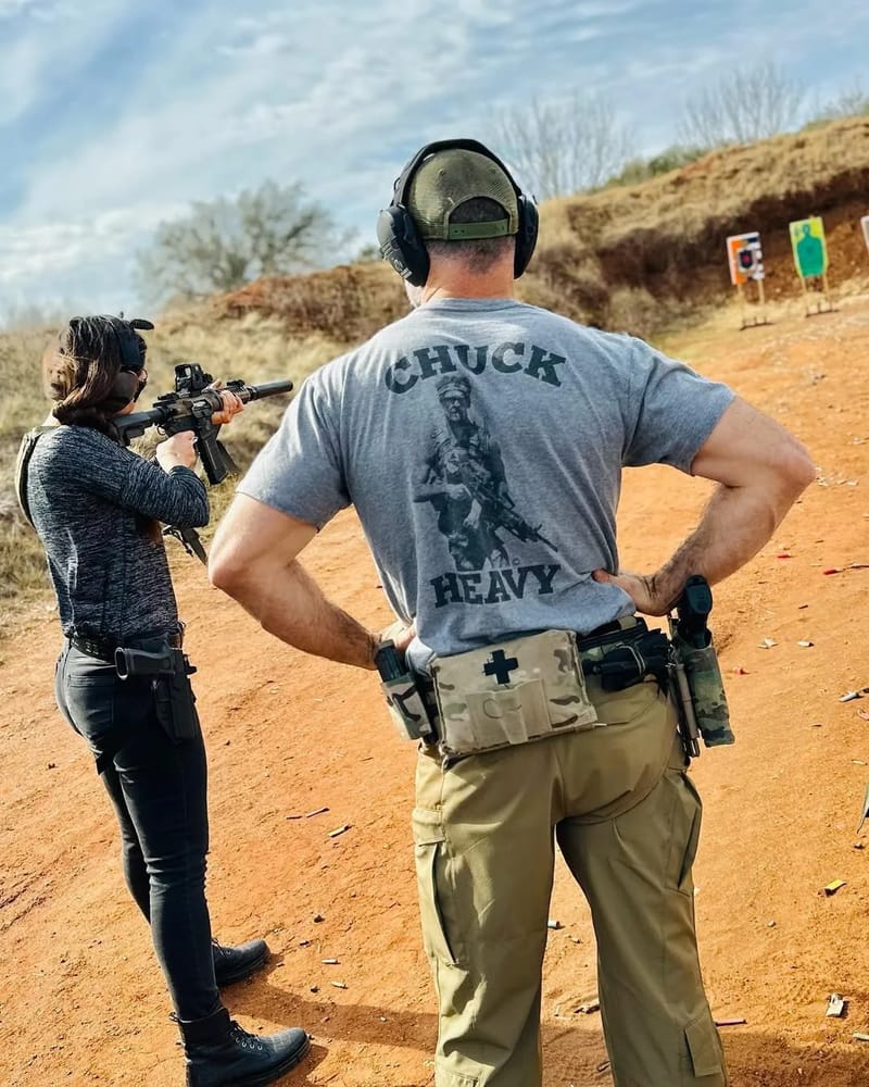 Chris Petkas watching a shooter run a carbine drill at an outdoor range
